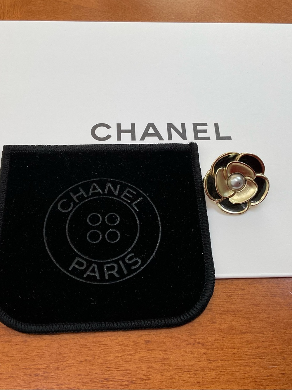 CHANEL Black and Gold camellia charm, Chanel Limited edition pouch. AUTHENTIC